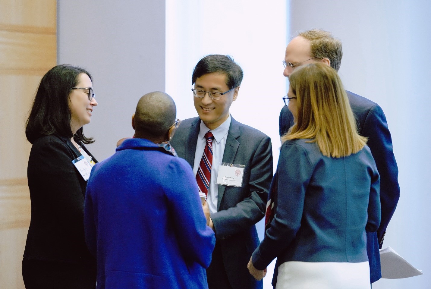 Dr. George Hong, President Tetlow and Provost Jacobs greet speakers from Columbia University and NYU.