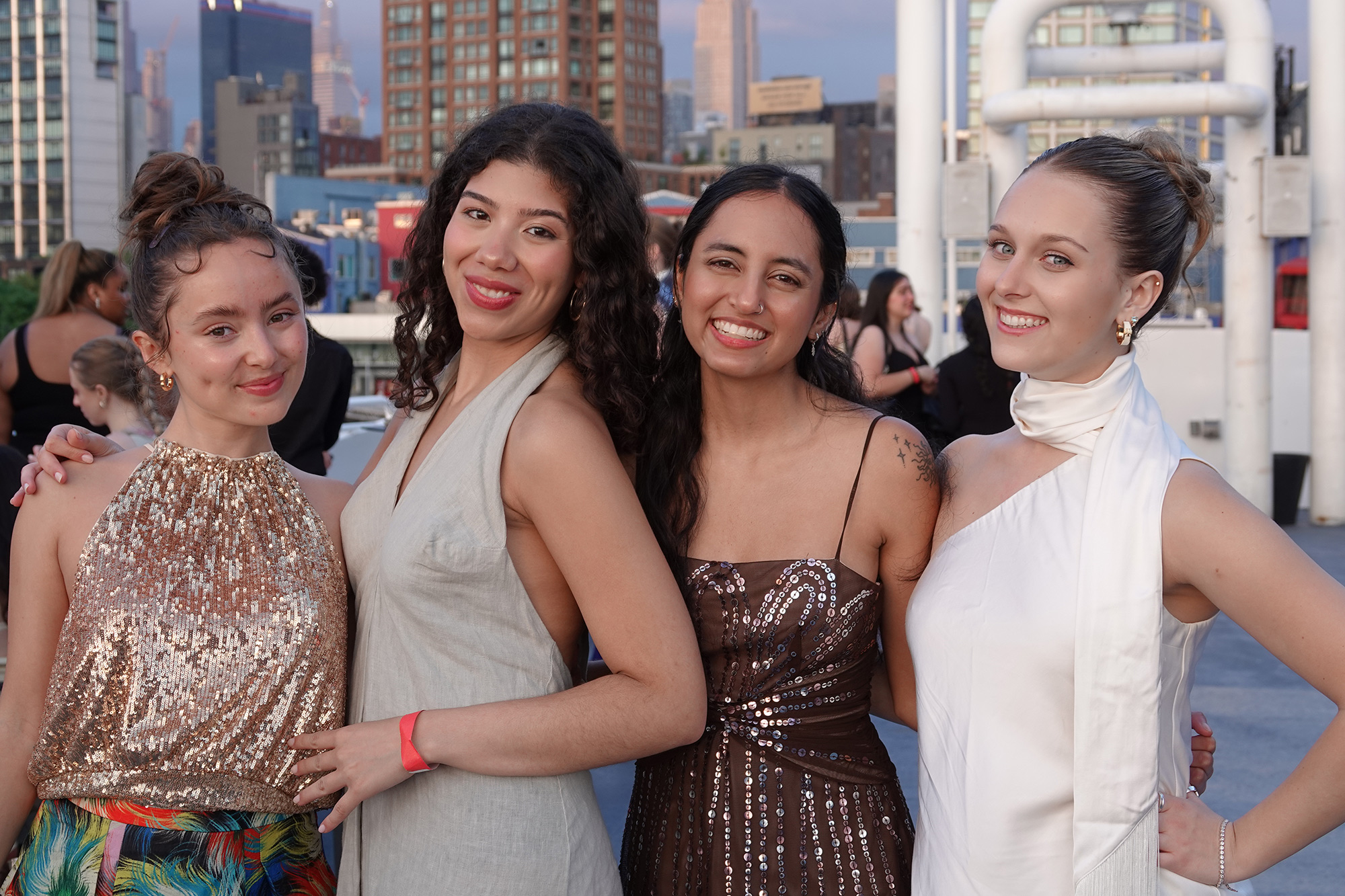 Four female students on the deck on the boat cruise from 2025