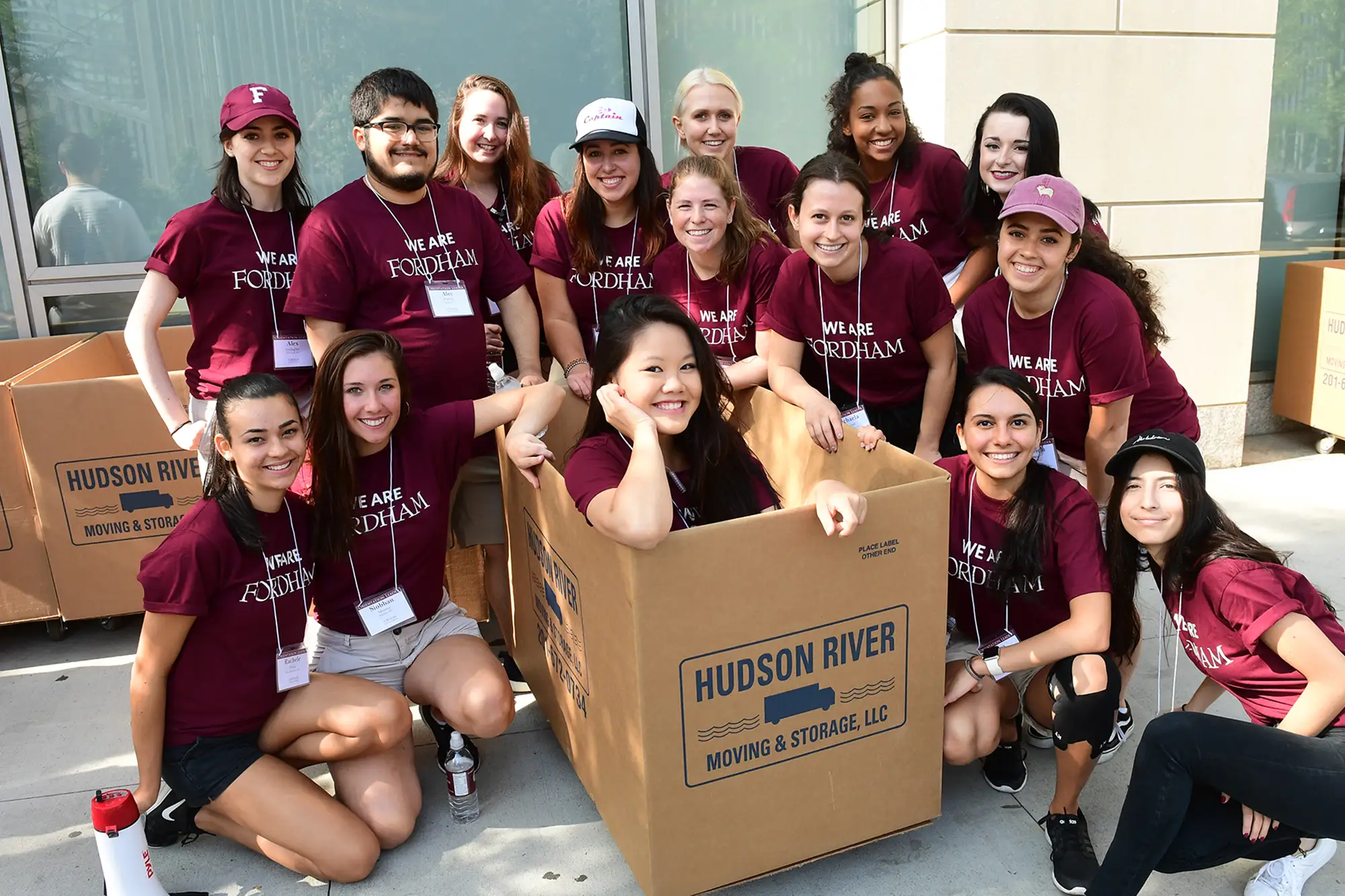 Several orientation leaders pose with moving boxes