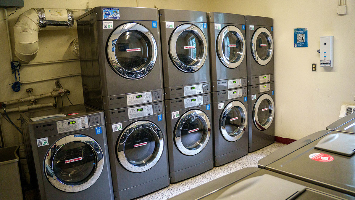 Stacked washer and dryer units in the share laundry space