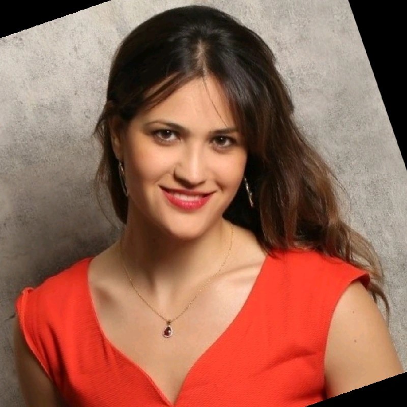 Abby Seneor Headshot against gray background