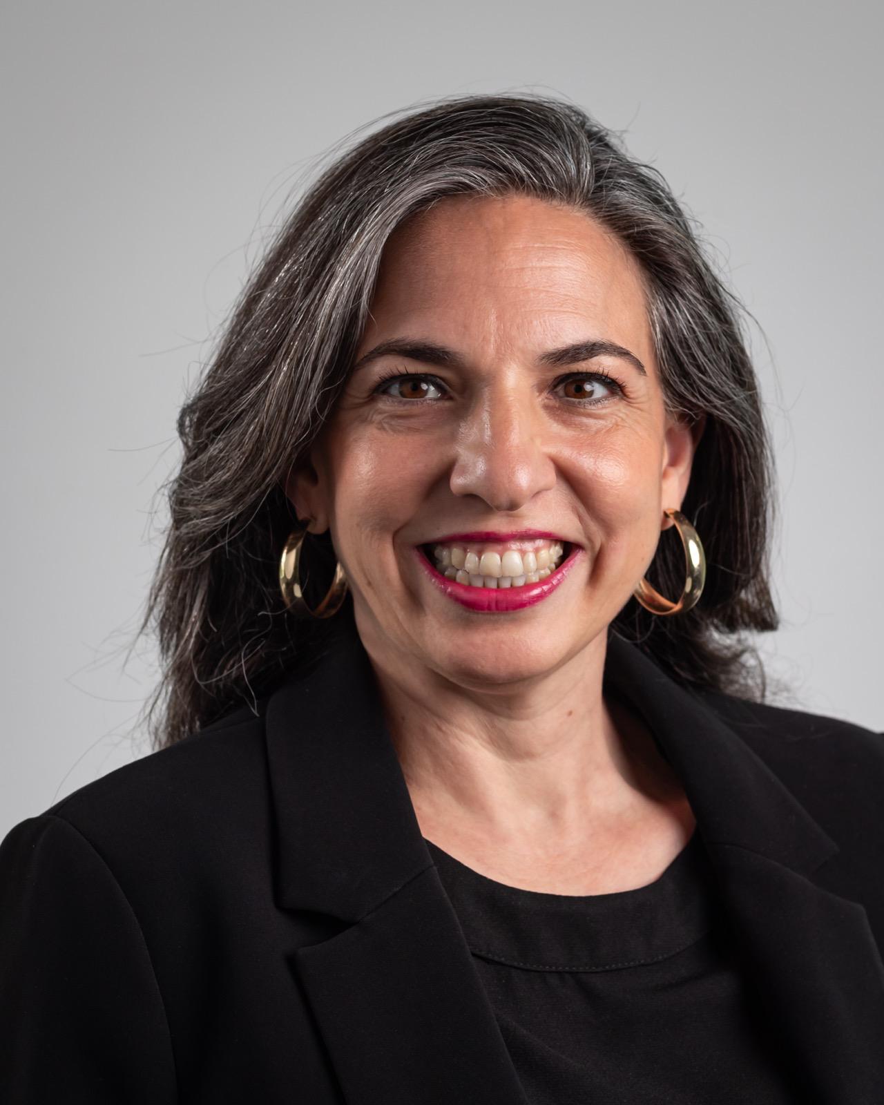 Dr Zeynep Hizir headshot against plain gray background
