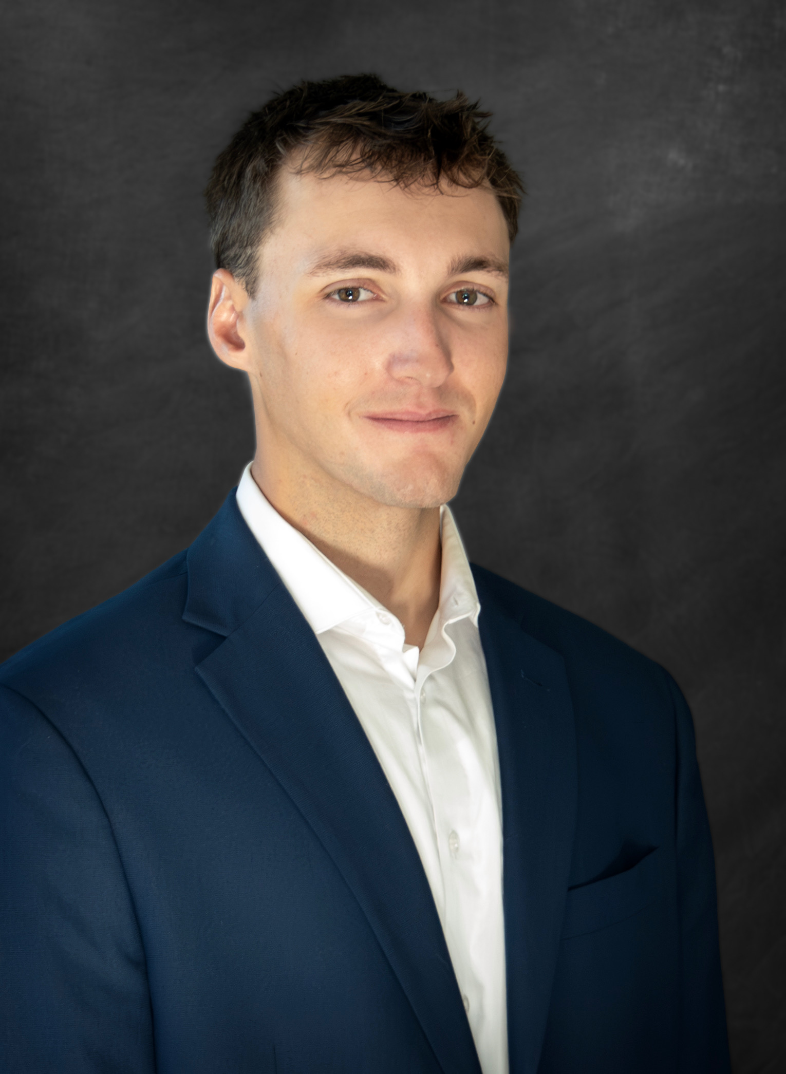 Erickson Rankin Headshot against dark plain background