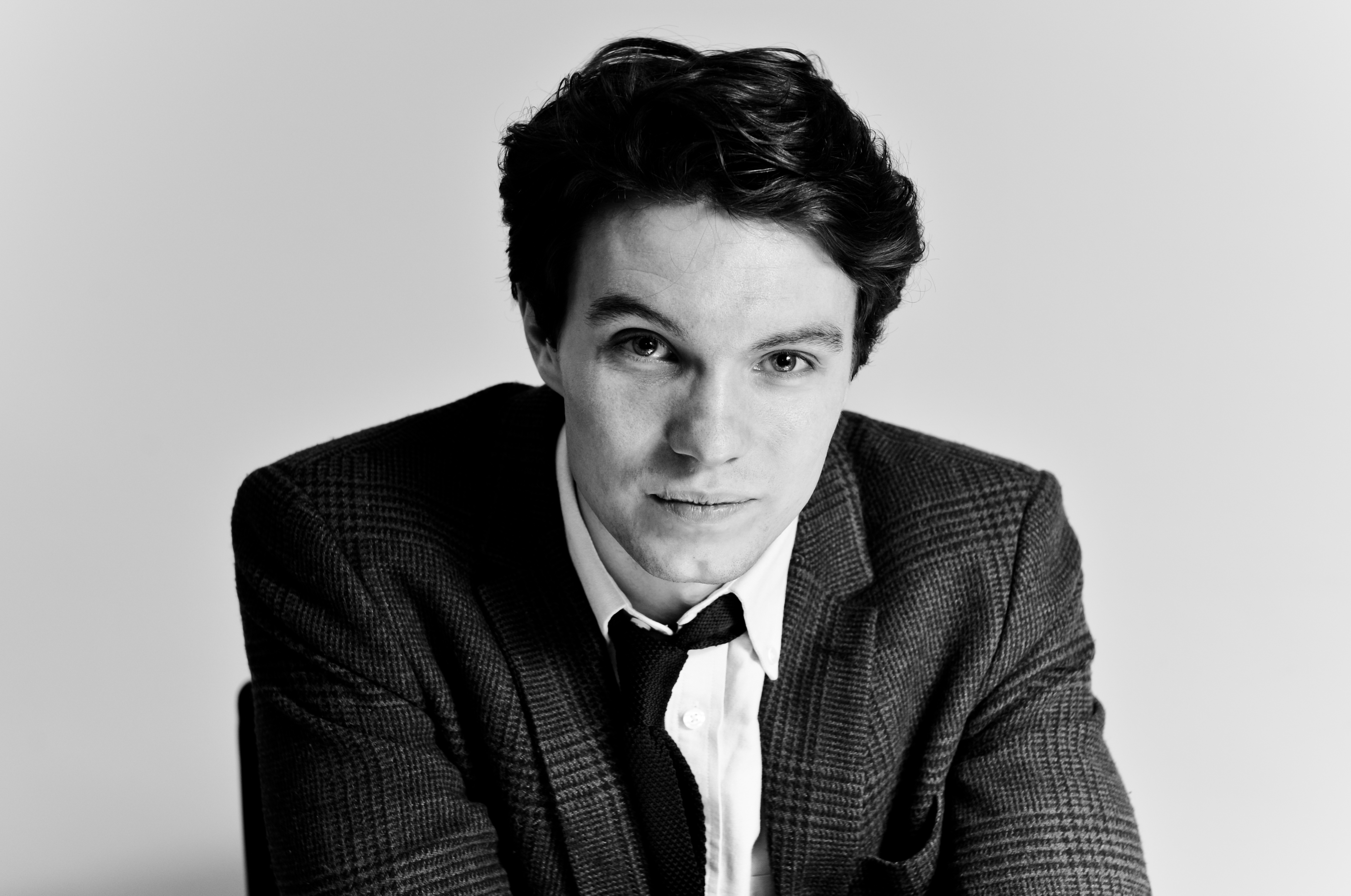 Black and white headshot of Sam Fowles with plain background