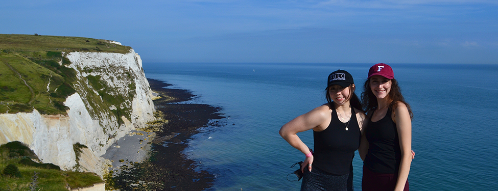 Students stand on cliffside