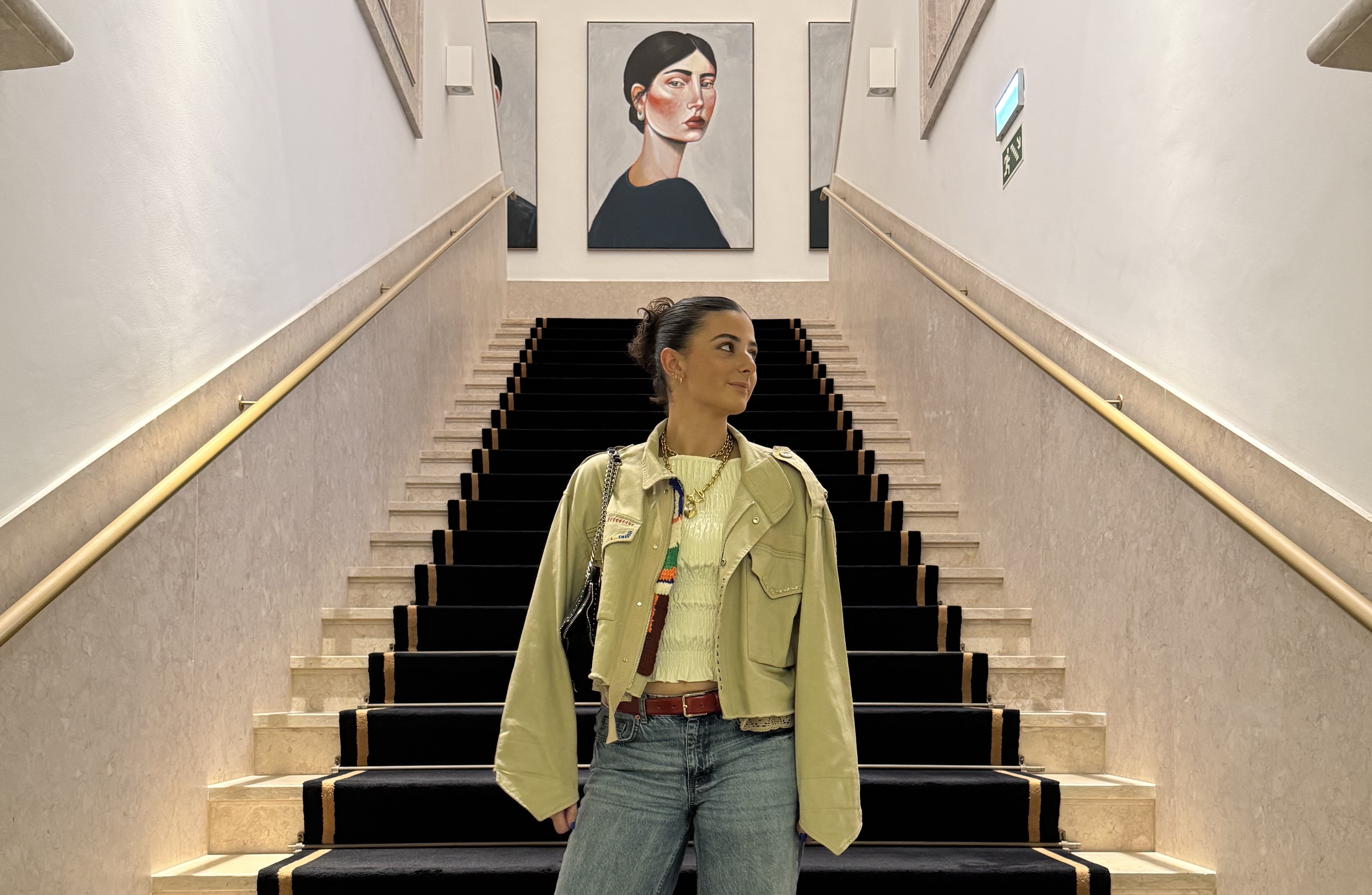 Student standing on stairs