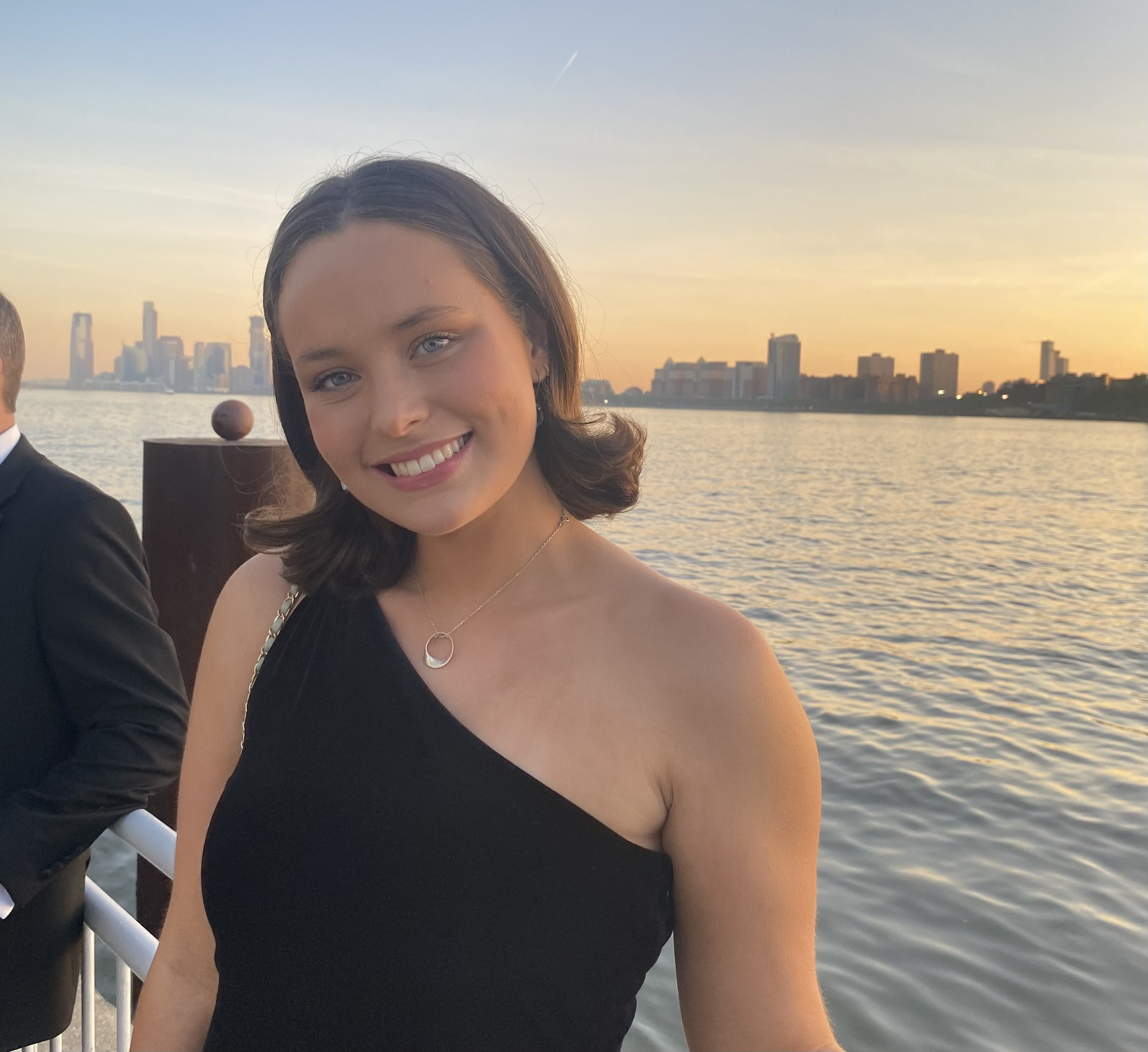 Student Standing in front of water