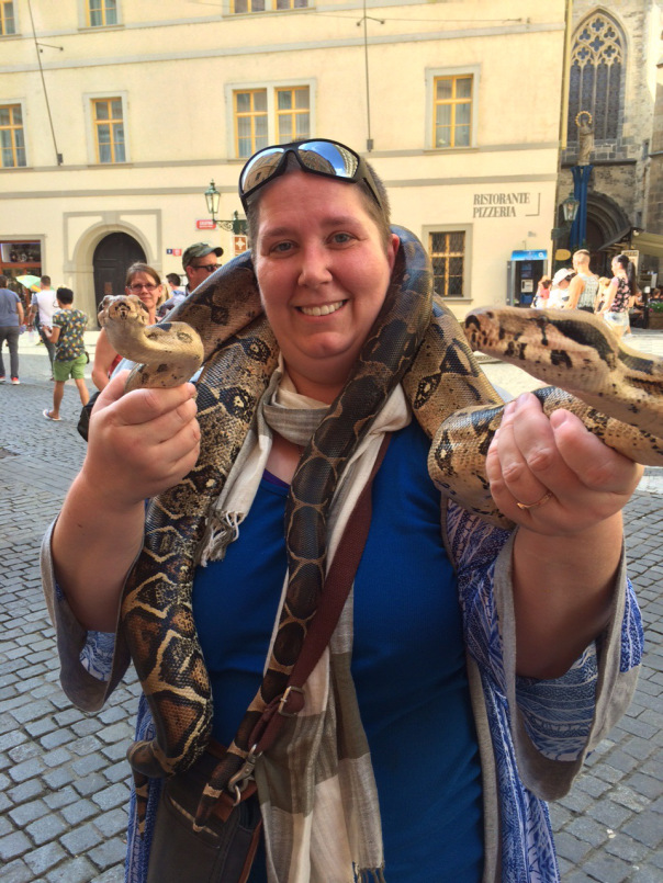 A photo of Galina Krasskova,  a doctoral student in the late antique and early medieval track in the Theology Department at Fordham University, with a snake around her neck