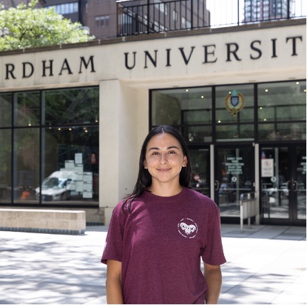 A student in front of a school at LC