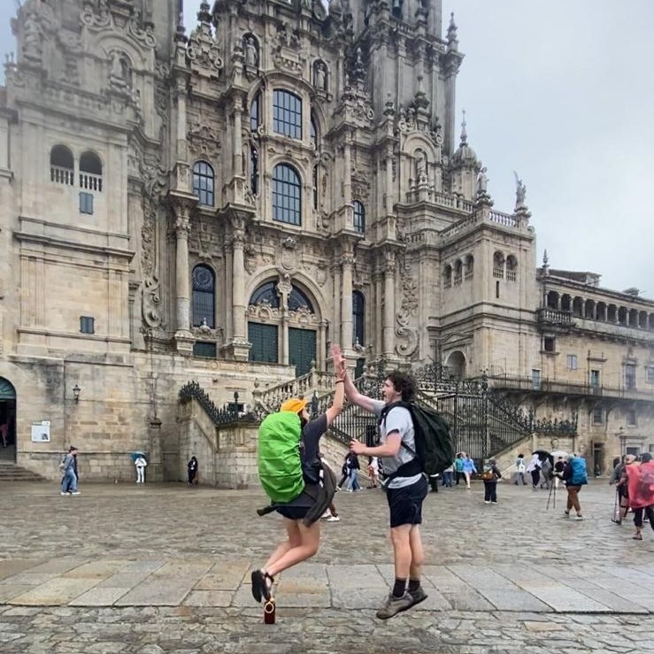 Students excited in front of a cathedral