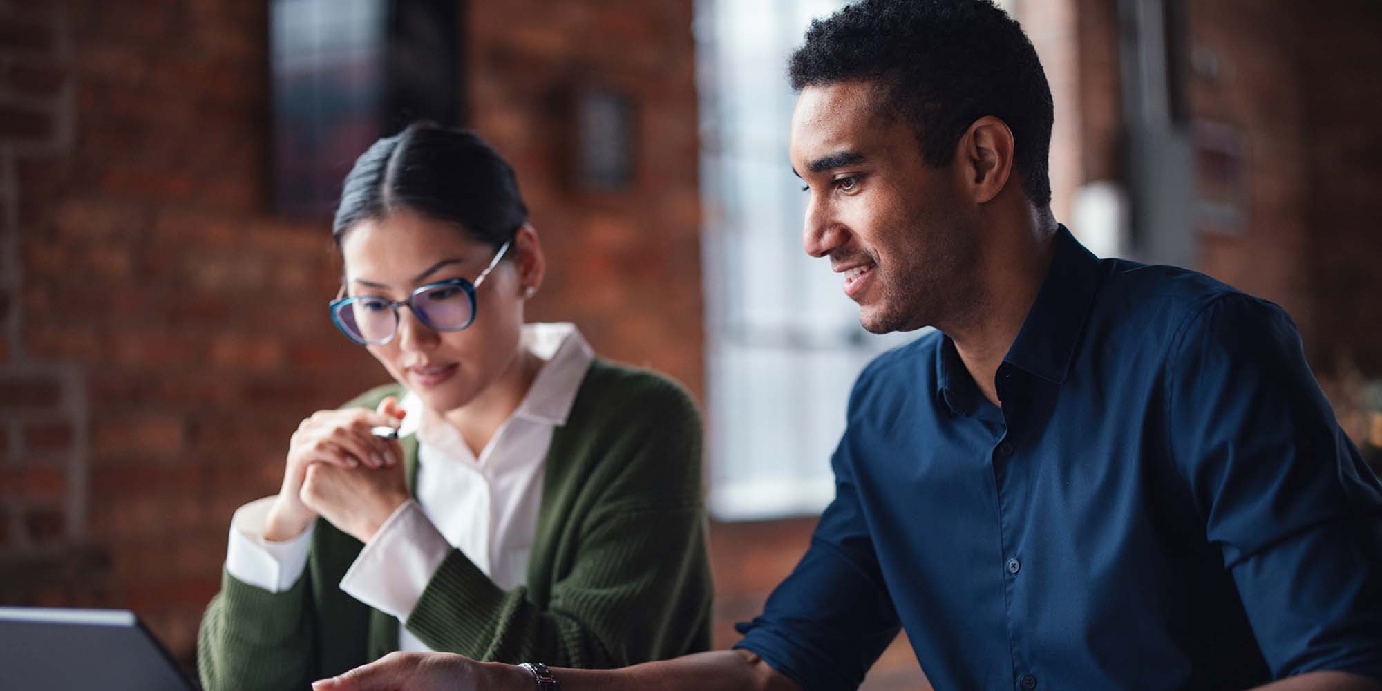 Two Students Looking at laptop
