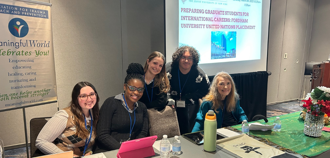Fordham GSS UN interns gather at a conference with Dr. Elaine Congress