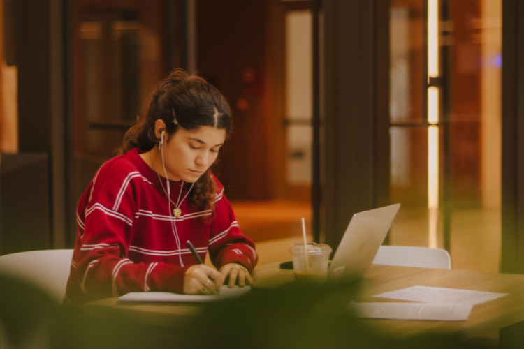 a student studying while listening to music
