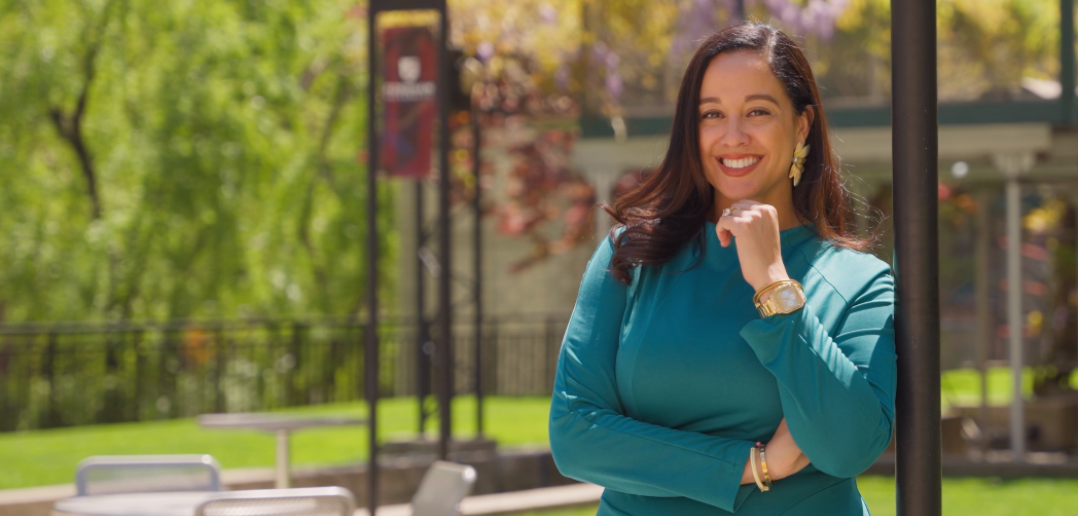 janet cohen standing in the courtyard of Fordham's Lincoln Center campus