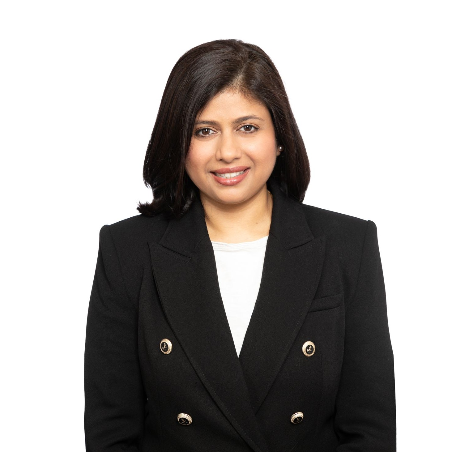 A woman with dark hair wearing a dark blazer and white shirt.