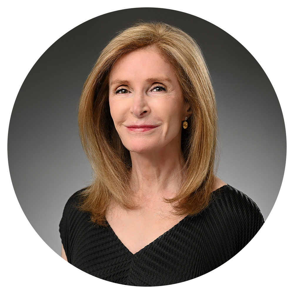 A woman wearing a black top.