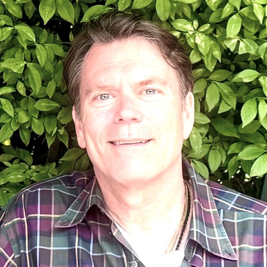 A man wearing a plaid shirt.