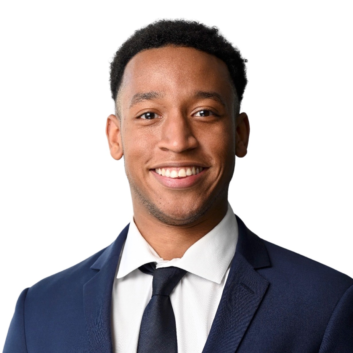 A man wearing a navy suit and tie.
