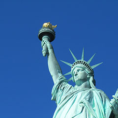 Statue of Liberty with blue sky background photo by Tony Wiek 240x240