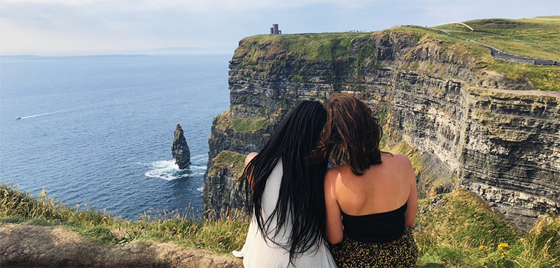 two students in Ireland touring cliffs