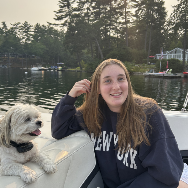 girl with dog on boat
