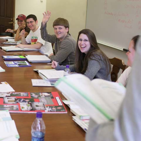 Row of students at conference table - LG