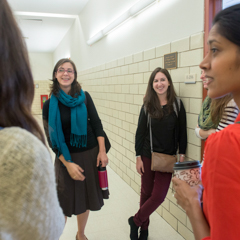 Group of female students chatting in hallway - SM