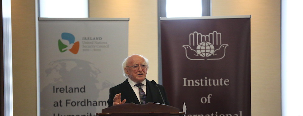 Speaker Michael D. Higgins standing at the podium delivering a lecture for the Ireland at Fordham Humanitarian Lecture Series