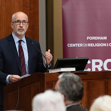 CRC Speaker at the Podium for the Pope Reform Event