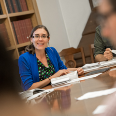 Female Grad Student at Conference Table - SM