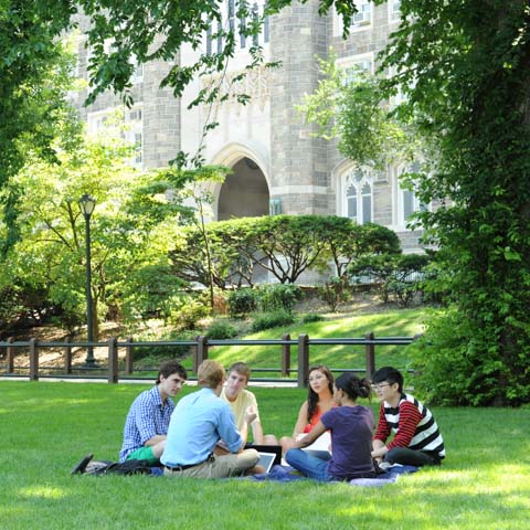 Circle of students sitting on lawn - LG