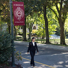 Dodransbicenntial Flag Banner with Student in Business Suit