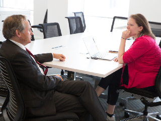 Two People in a Meeting.