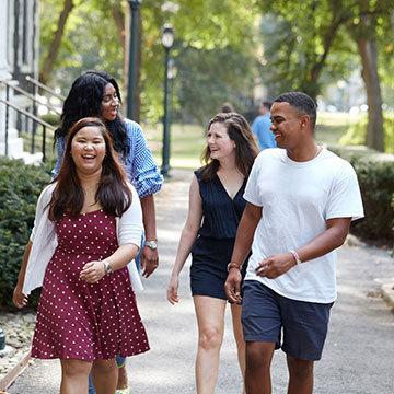 Four students walking at rose hill