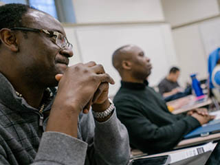 Graduate students in classroom.