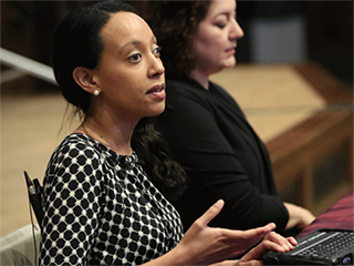 Haben Girma uses a keyboard with braille display at the April 11 Distinguished Lecture on Disability