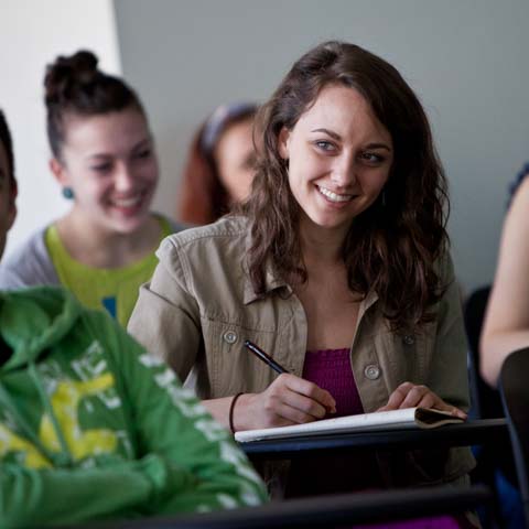 Female Student Smiles in Classroom