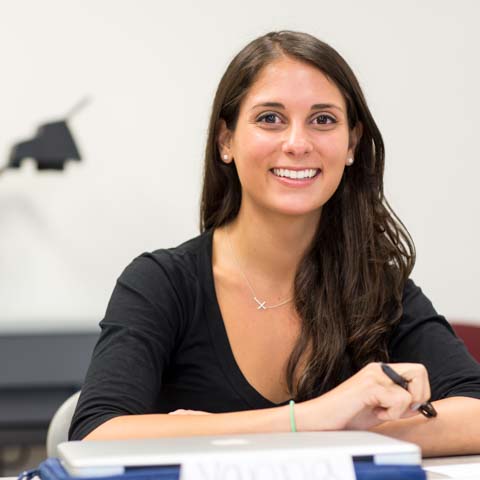 Female student smiles into the camera - LG