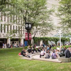 Students sitting in front of LC building - SM