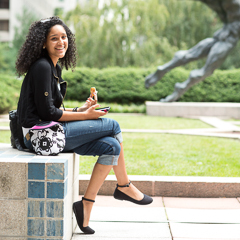 Female Student has Lunch Outside