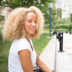 Female Student Sits in LC Plaza