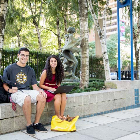 Two students sitting in LC plaza - LG