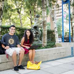 Two students sitting in LC plaza - SM