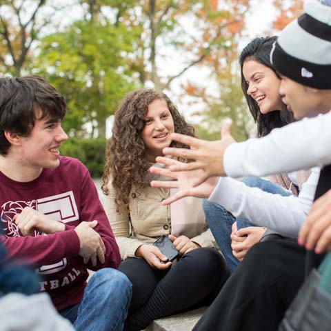 Group of students sitting outside at Rose Hill - LG