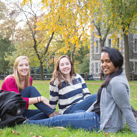 Three female students sitting outside at Rose Hll - LG
