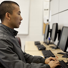 Student on a Computer - Small, Square Crop