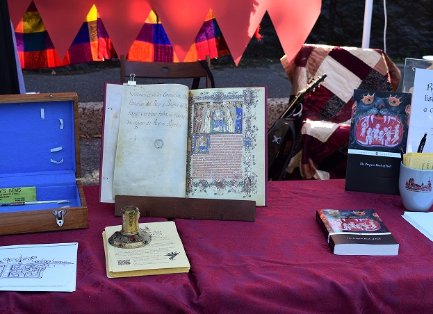 Medieval facsimiles and other materials displayed at Fordham's table at the Medieval Festival