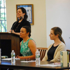 Presents with Speaker at Podium