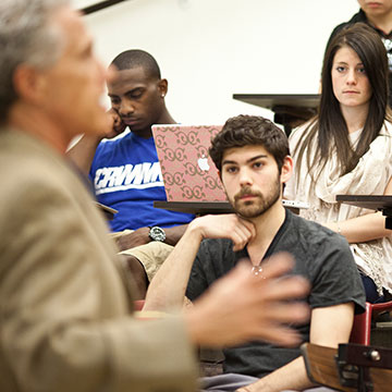 Professor and students in a classroom during a lecture