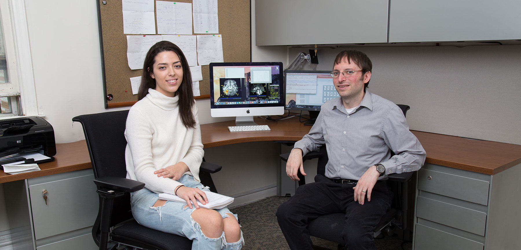 Professor Daniels Leeds with Student in Office